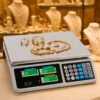 Balanza digital de precisión en mostrador de joyería para pesaje de piezas